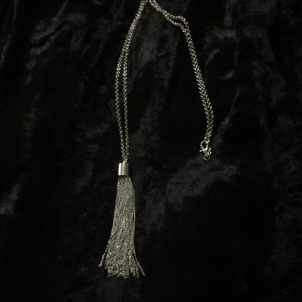 Silver chain with tassel.